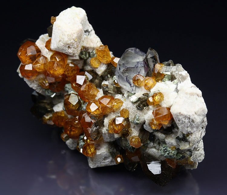 gem GARNET var. SPESSARTINE, FLUORITE, QUARTZ var. SMOKY, MUSCOVITE, MICROCLINE