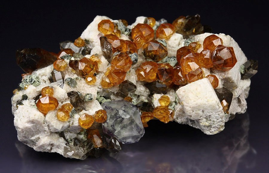 gem GARNET var. SPESSARTINE, FLUORITE, QUARTZ var. SMOKY, MUSCOVITE, MICROCLINE