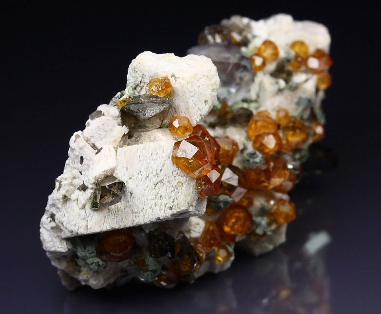 gem GARNET var. SPESSARTINE, FLUORITE, QUARTZ var. SMOKY, MUSCOVITE, MICROCLINE