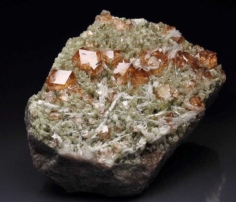 gem GARNET var. GROSSULAR with PECTOLITE inclusions, DIOPSIDE 