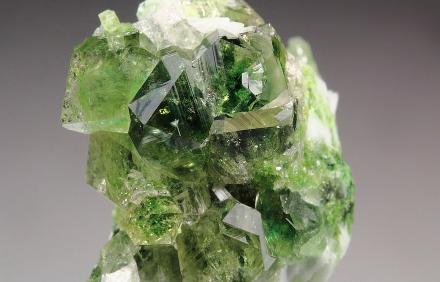 gem GARNET var. GROSSULAR with GREEN CHROMIAN PHANTOMS, DIOPSIDE, ALBITE