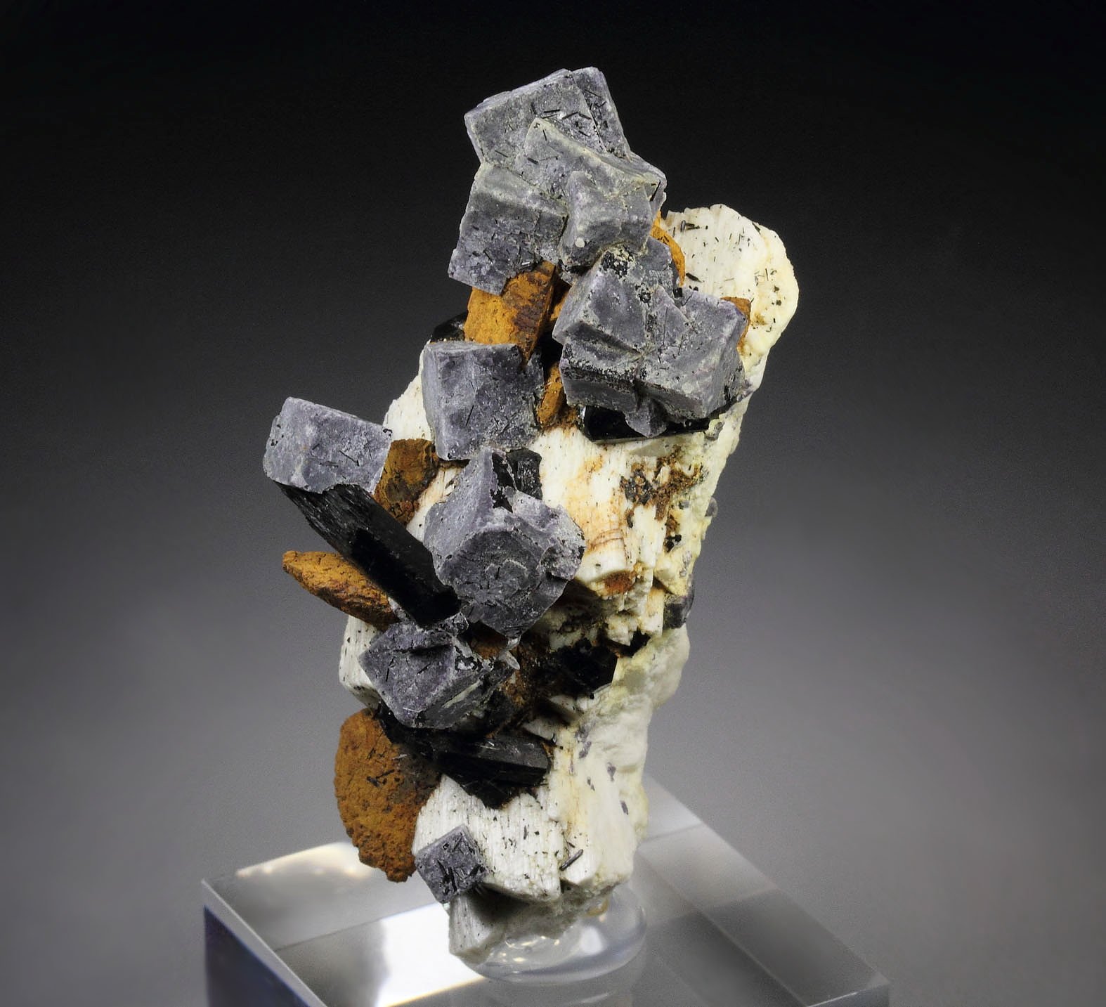 pseudomorph after FLUORITE, GOETHITE pseudomorph after SIDERITE, TOURMALINE var. SCHORL, MICROCLINE